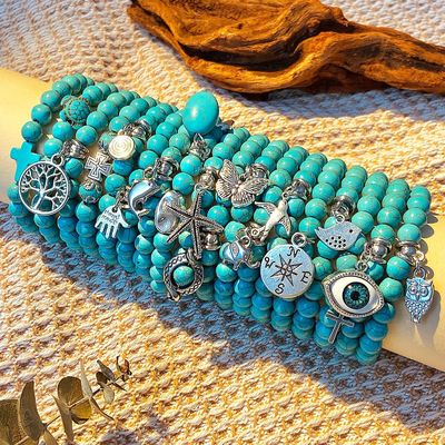 Ein guter Preis. Böhmisch-turkisfarbenes Perlenarmband ethnisches Kreuz Meeressternschildkrötenarmband europäisches und amerikanisches Turkisarmband Online