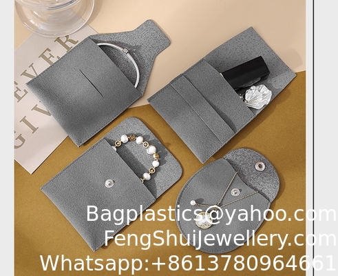 Buen precio Bolsa de franela gris con LOGO personalizado de energía Feng Shui, bolsa de tela gruesa con broche, bolsa de almacenamiento de anillos de franela de microfibra, bolsa de joyería en línea